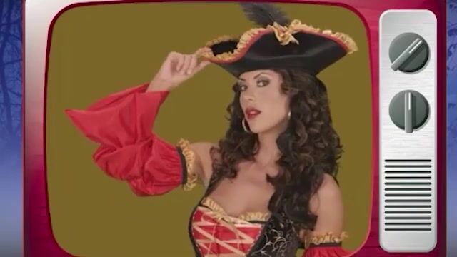 Set sail in this glorious homage to Spanish Pirates. This extravagant ensemble includes a black velveteen vest with gold scroll motif and ribbon lacing over a red satin dress with detached sleeves. Finishing touches include a belt with ornate buckle, a pirate's pouch and ruffle trimmed tricorn hat.